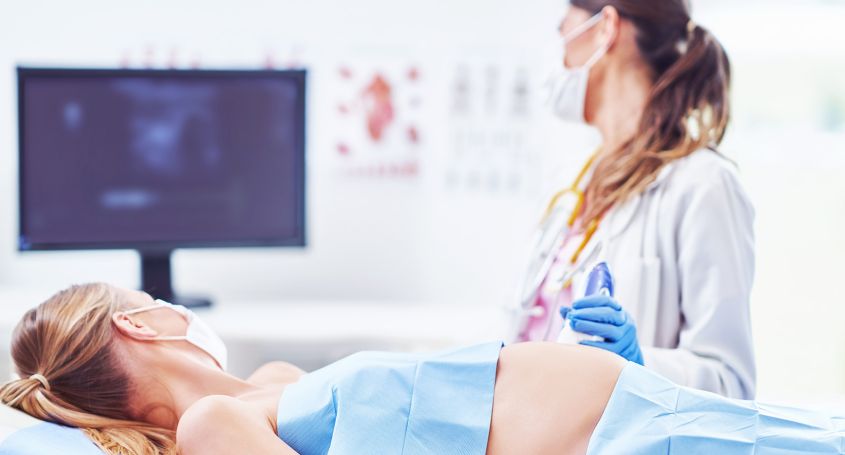 What is amniocentesis and when is it performed?